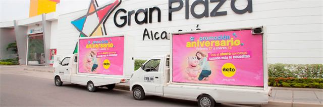 Mobile outdoor advertising billboards for Éxito in front of Gran Plaza