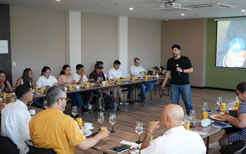 Talk at a business event with a speaker and attendees at tables